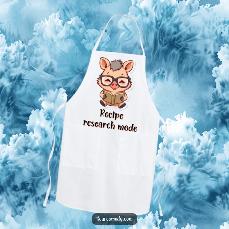 Funny kitchen apron showcasing a happy boar character wearing large glasses and diligently reading a tiny book.