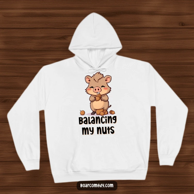 Funny Kawaii Boar Hoodie with a mischievous grin, expertly balancing a pile of acorns, suggesting playful resourcefulness.