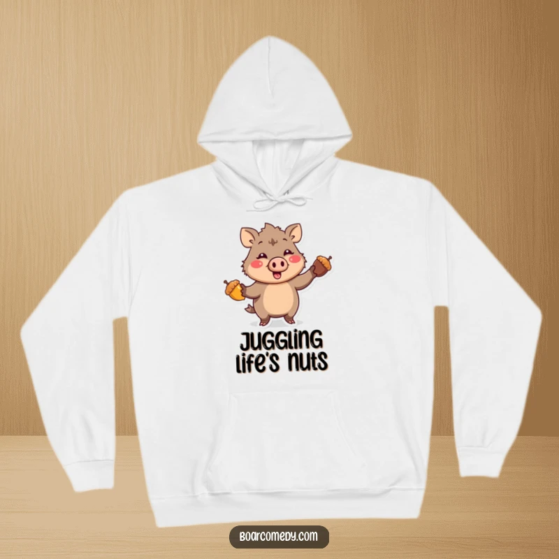 Funny Kawaii Boar character with a comical expression, enthusiastically juggling three bright acorns, printed on a warm, comfortable hoodie.