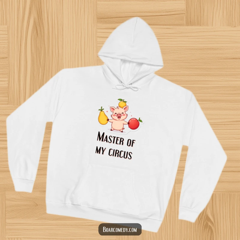 Funny happy boar character juggling three large, colorful fruits, a cozy and vibrant hoodie design for active enjoyment.