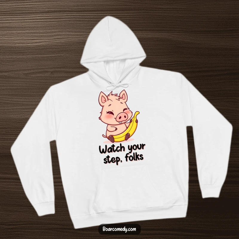 Funny winking boar character holding a tiny banana peel, a cozy hoodie design for those who enjoy lighthearted mischief.