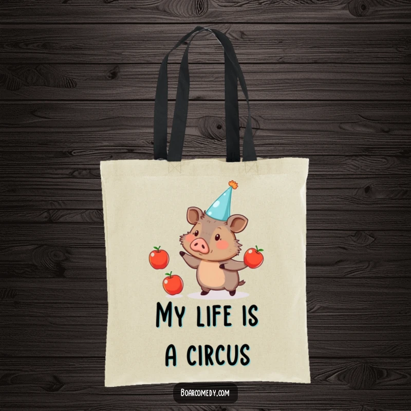 Funny Tote Bag: Cute boar with a party hat, amusingly juggling three apples, perfect for carrying essentials with humor.
